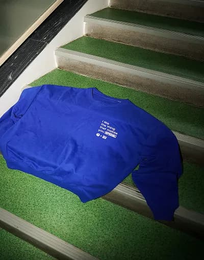 Blue OH-SO sweater photographed on the stairs